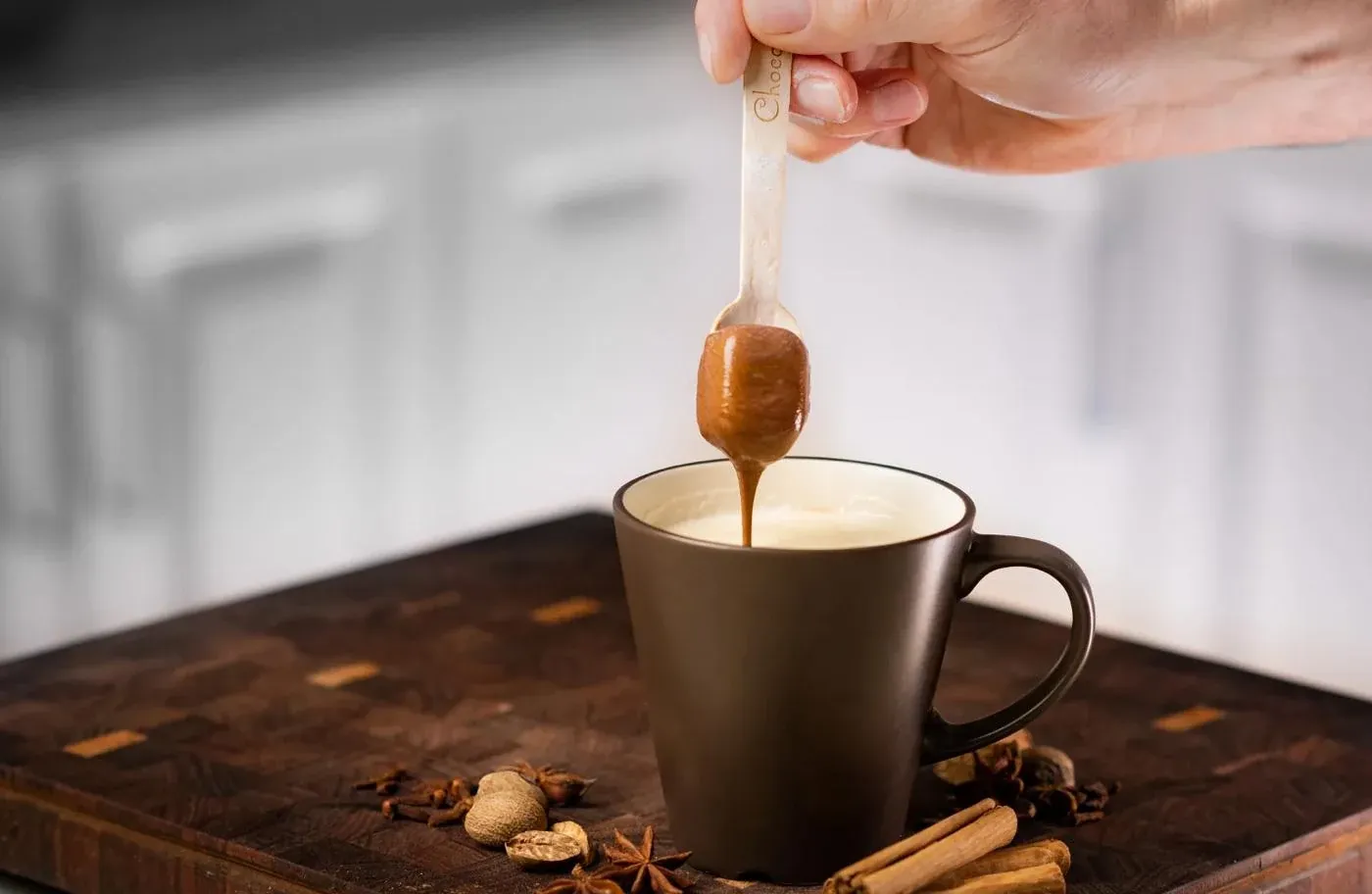 Drinking chocolate dripping into cup